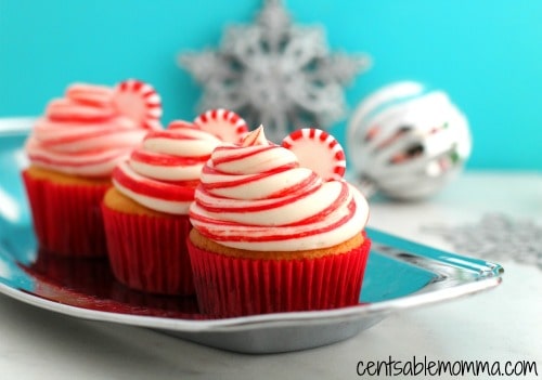 Made with a base of boxed cake mix (and added melted white chocolate), these Peppermint White Chocolate Cupcakes are super easy to create! The peppermint frosting has red food coloring stripes to make them look like candy canes - so cute!