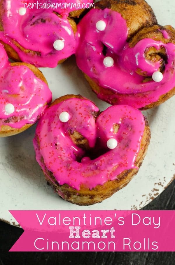 Easily create these Heart-shaped cinnamon rolls for Valentine's Day using a can of Pillsbury cinnamon rolls, some pink food coloring gel, and sprinkles - perfect for a fun holiday breakfast!