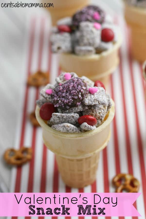 Make Valentine's Day fun and yummy with this Valentine's Day Snack Mix recipe with a mix of muddy buddies, chocolate pretzel hearts, and M&M's in a cute ice cream cone container. Perfect for a class party or a party at home.