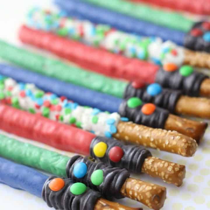 Star Wars lightsaber pretzel rods lined up in a row with text overlay.